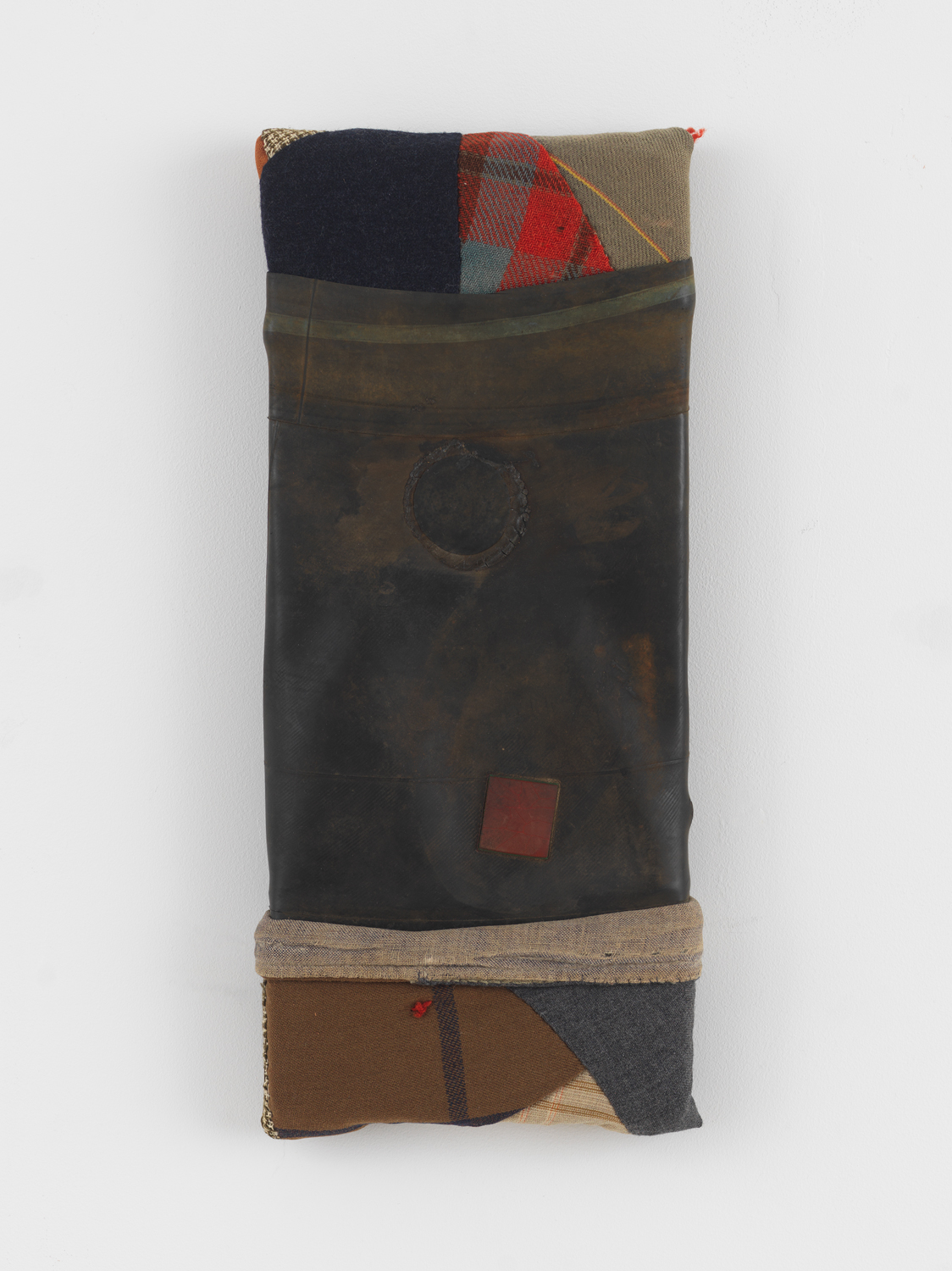 Dan Dowd, Found patched truck tire innertube rubber, found quilt fragments on found board, 2012, 14 x 6 x 2 in.