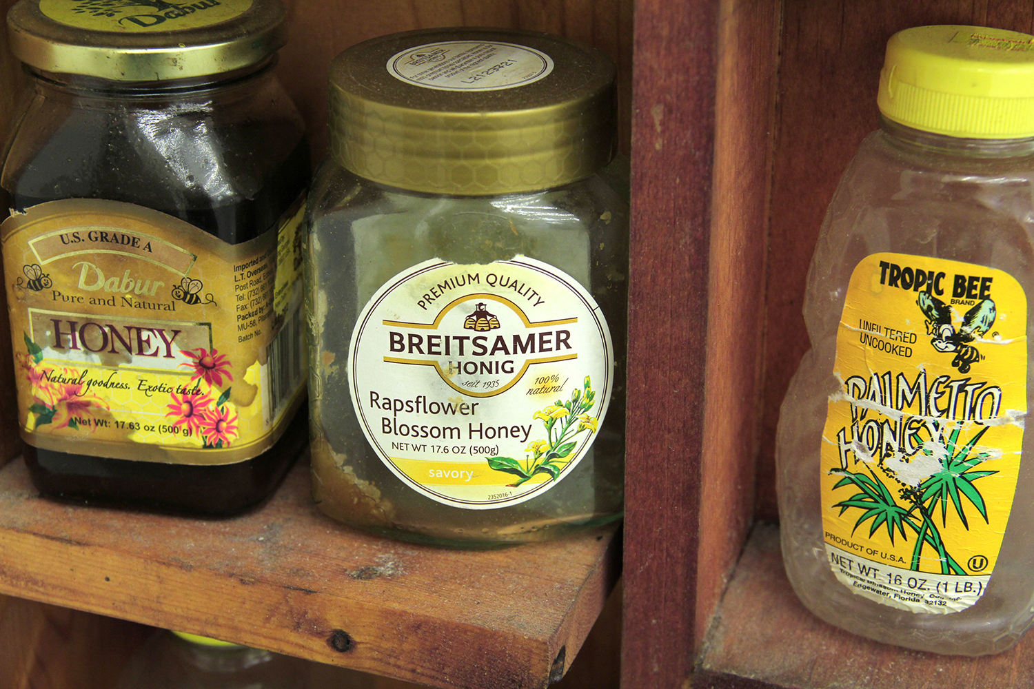 Thatcher Keats, Honey Shelf, 2013, wood, honey jars, honey, screws, glue, 96h x 11.5w x 5d in.